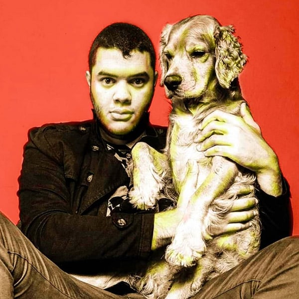 A portrait of Franco Barco with his dog.